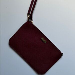 Kate spade wristlet. Color red/garnet. Condition like new